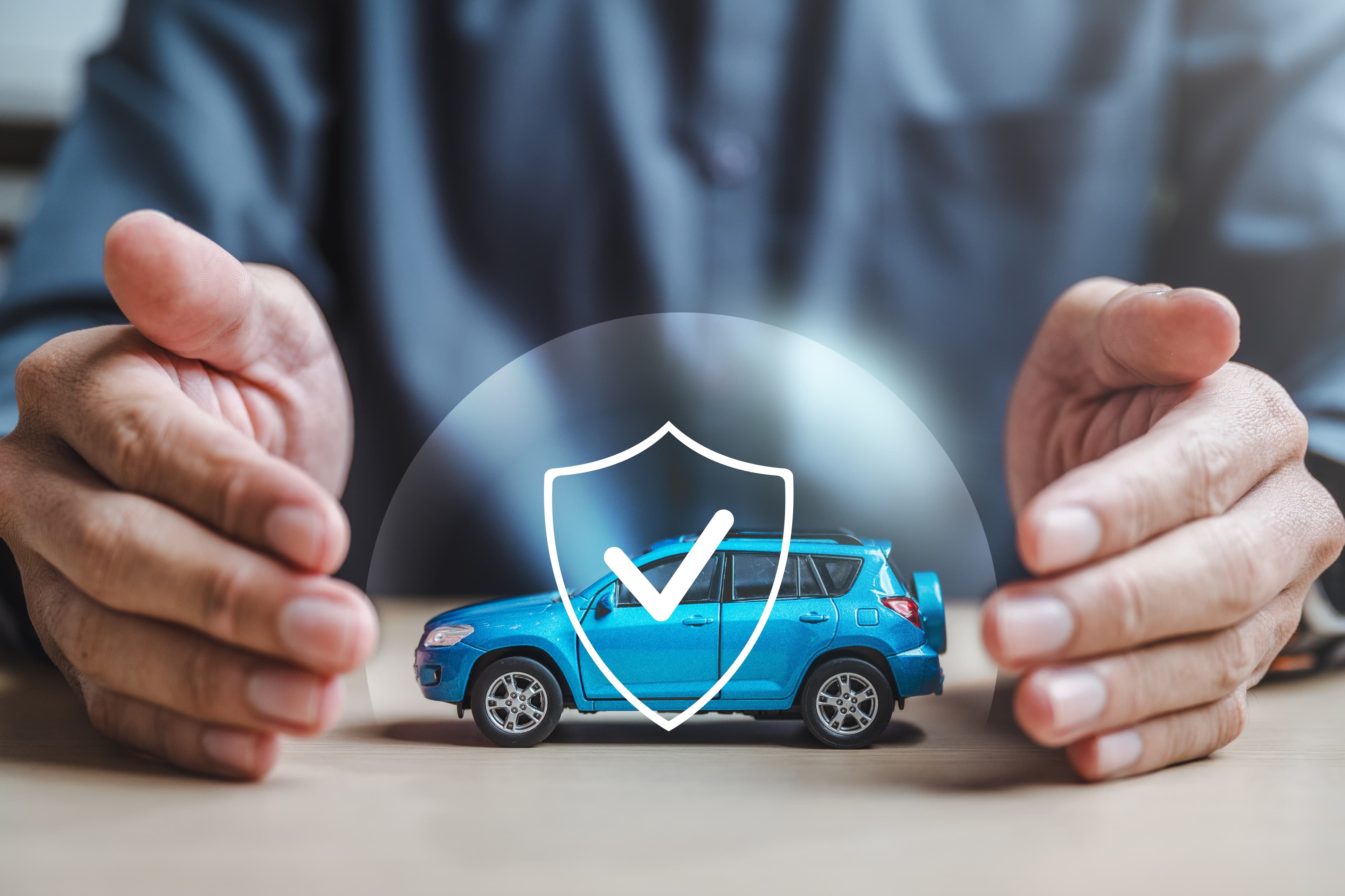 Vehicle protected by warranty shield representing ArmourOne Automotive National Lifetime Warranty